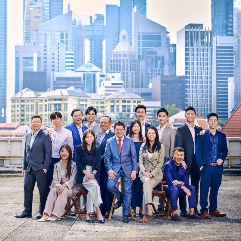 Singapore corporate portrait photography: corporate group portrait. Corporate group portrait photographer Singapore — executive team portrait with Singapore skyline background, singapore corporate portrait photography
