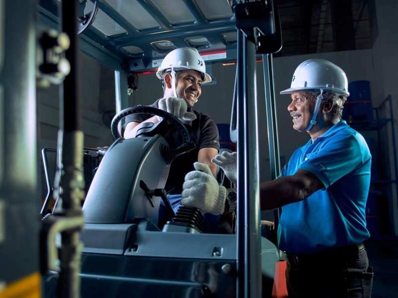 Singapore maritime videography: industrial portrait photography of the forklift instrcutor guiding trainee during the forklift course by Bok Seng — Singapore industrial photographer