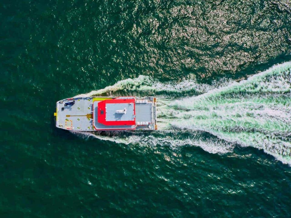 Overhead aerial of an offshore wind crew transfer vessel under way — Singapore industrial photography, aerial marine, drone maritime photography