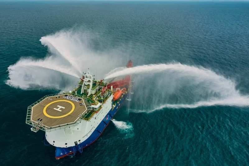 Aerial view of the Safeen Centurion 2 firing its fire-fighting monitors during a FiFi capability test — industrial photography Singapore, aerial photography, drone maritime photography