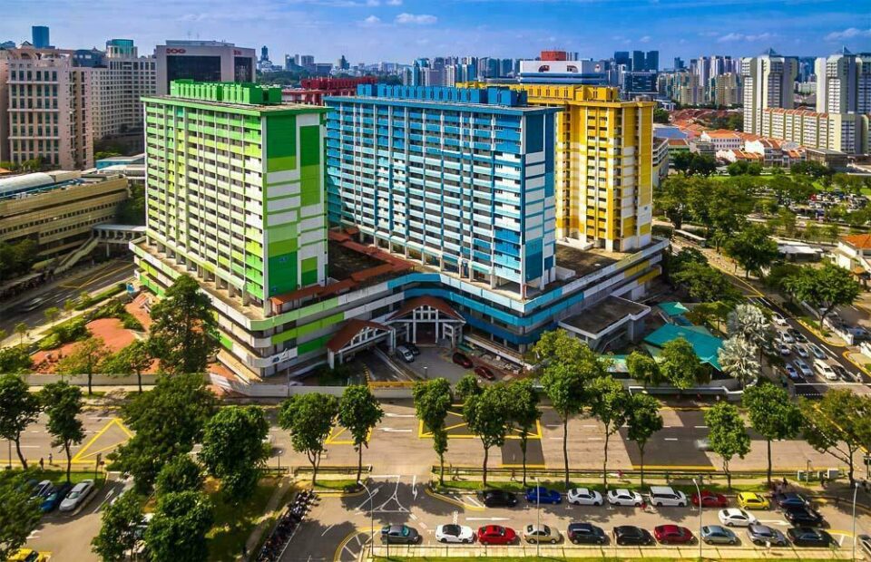 The rainbow-coloured Rochor Centre HDB blocks from the air, before demolition — aerial photography Singapore
