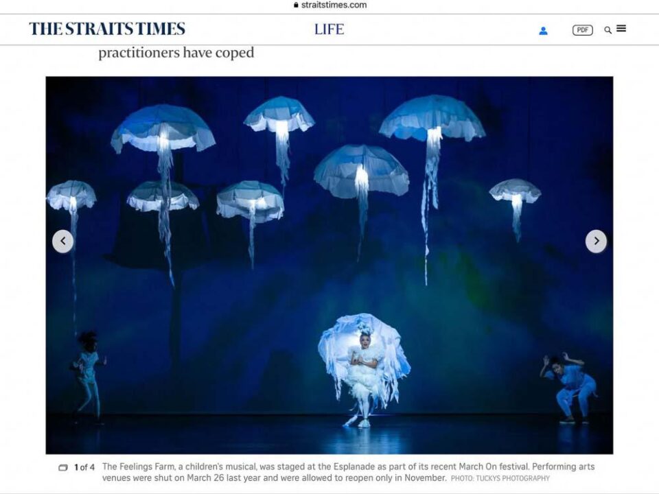 Singapore creative portrait photography: underwater portrait. The Straits Times article with Tuckys Photography's image of glowing jellyfish over the stage in The Feelings Farm