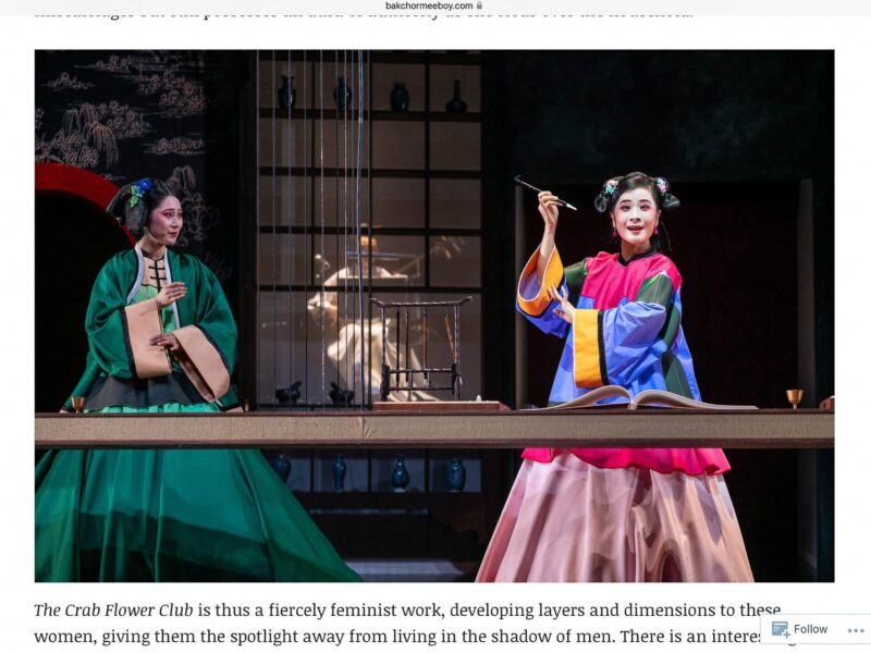 Singapore theatre photography: theatre press coverage. Bakchormeeboy review page with Tuckys Photography's image of two performers in Qing costume at a long table, one holding a brush, in The Crab Flower Club